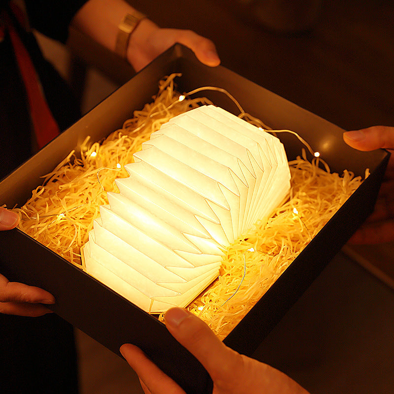 Ember & Oak Accordion Lamp glowing warm light