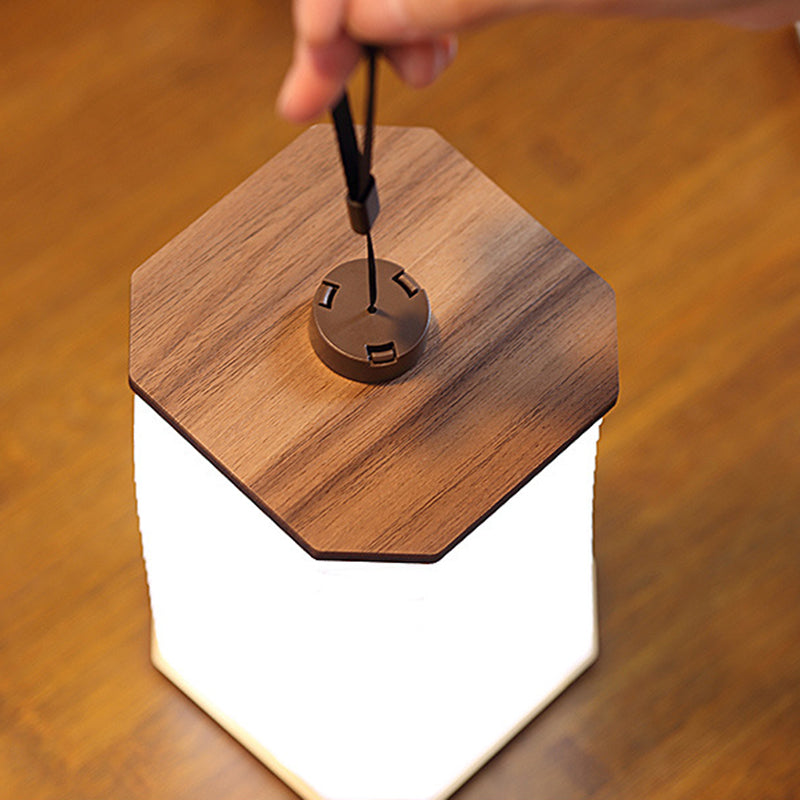 Folding wooden accordion lamp opened into sculptural shape